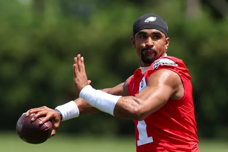 Jalen Hurts throws a football during Eagles minicamp practice this week.