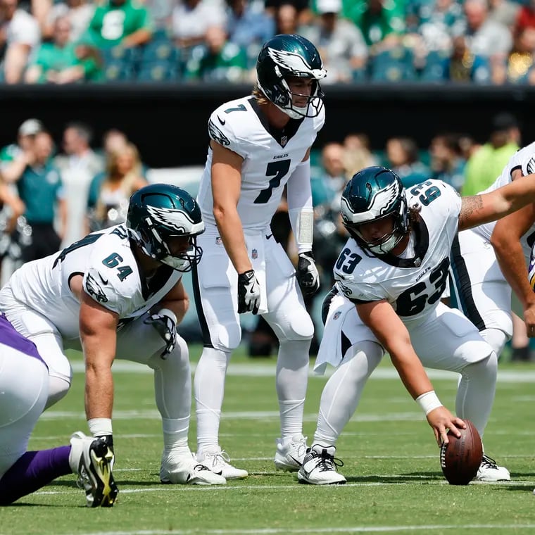 Eagles center Dylan McMahon signals at the line with quarterback Kenny Pickett during a preseason game against the Minnesota Vikings on Aug. 24.