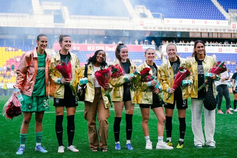 Gotham FC honored its Olympians (from left) Ann Katrin-Berger of Germany, and Tierna Davidson, Crystal Dunn, Rose Lavelle, Jenna Nighswonger, Emily Sonnett, and Lynn Williams of the United States after Saturday's win over the Portland Thorns.