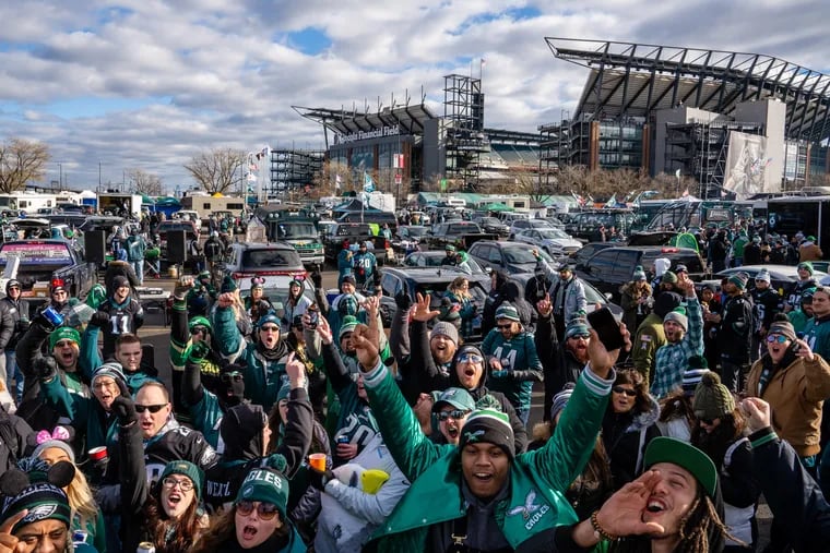 A crowd cheers during the tailgate at Lincoln Financial Field in South Philadelphia, Sunday, Jan. 5, 2020.