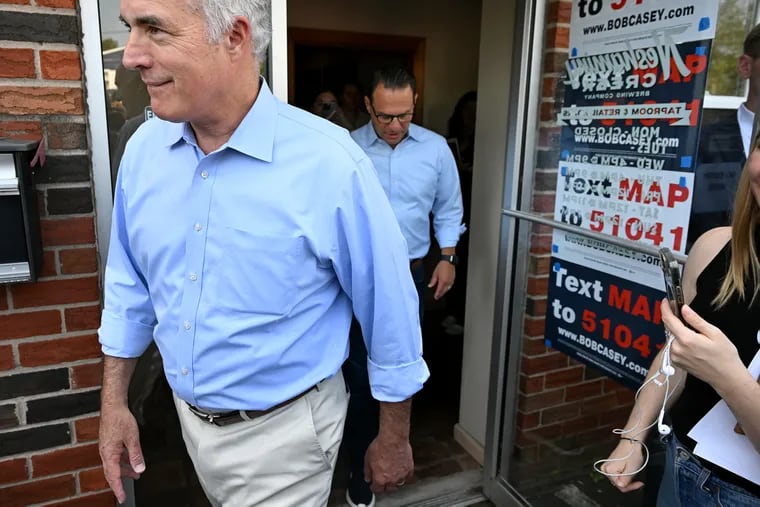 Gov. Josh Shapiro (rear) on Monday campaigned in Croydon for U.S. Sen. Bob Casey at a “Bucks for Bob” event at Neshaminy Creek Brewing.