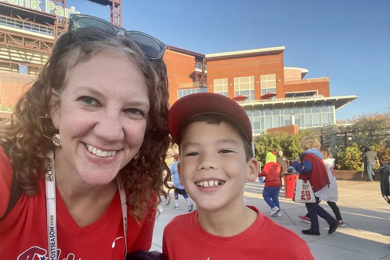 Kristen A. Graham and son Kieran Goh, 9, outside Citizens Bank Park at Game 4 of the National League Championship Series.
