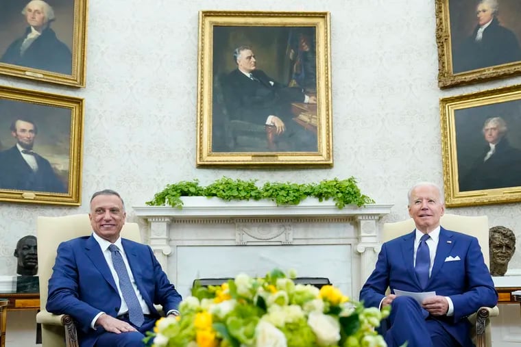 President Joe Biden (right) meets with Iraqi Prime Minister Mustafa al-Kadhimi in the Oval Office of the White House.