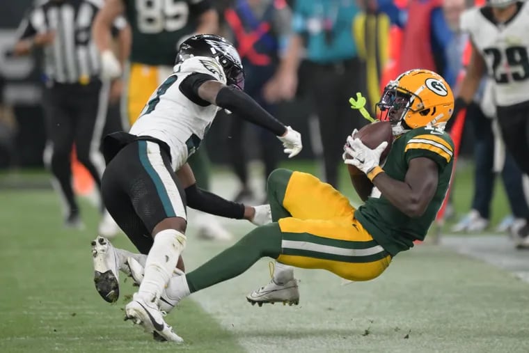 Eagles cornerback  Quinyon Mitchell tackles Green Bay's Jayden Reed during the fourth quarter of the season opener in São Paulo, Brazil.