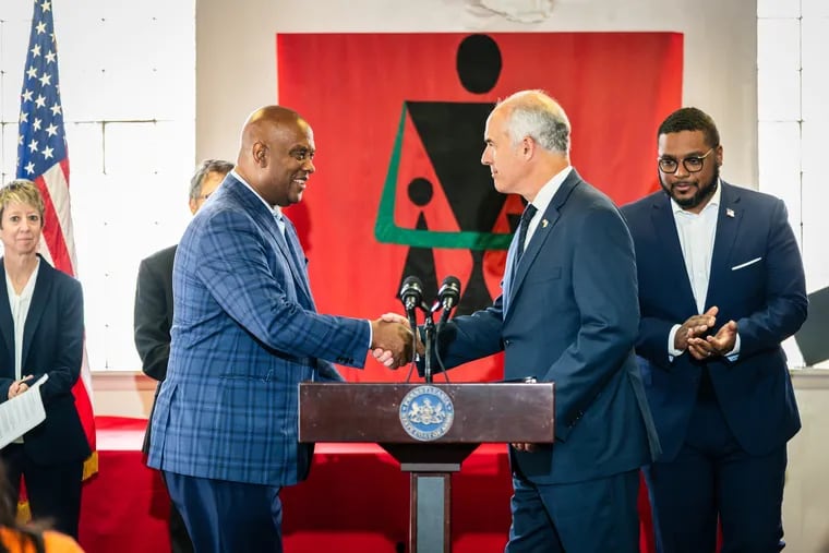 U.S. Rep. Dwight Evans, left, and U.S. Sen. Bob Casey, right, shake hands at a Philadelphia news conference Friday announcing plans to reintroduce the Resources for Victims of Gun Violence Act, June 9, 2023. It took place at the Philadelphia chapter in West Oak Lane of Concerned Black Men of America.