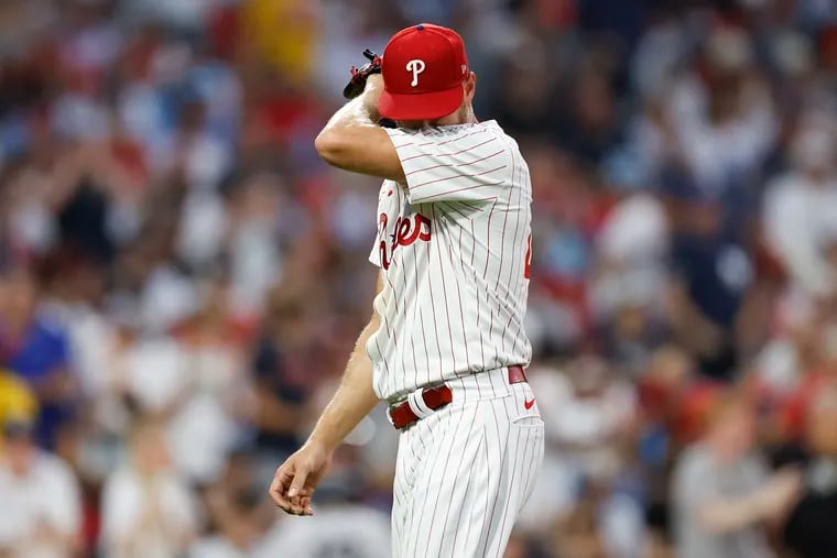 Phillies pitcher Zack Wheeler wipes his face after giving-up four runs in the fifth inning to New York Yankees on Monday, July 29, 2024 in Philadelphia.