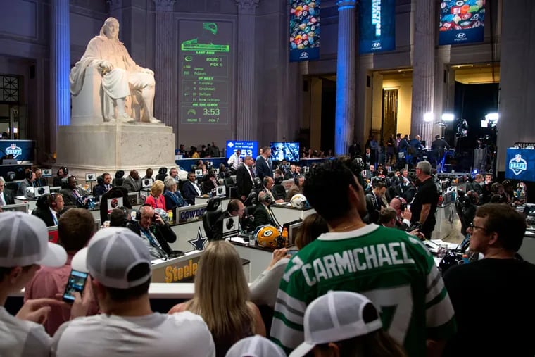 Fans watch the 2017 NFL draft at the Franklin Institute in Philadelphia.