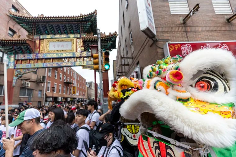 A Chinese lion performer near the Chinatown Friendship Gate during the rally and march for the 'No Arena In The Heart of Our City' demonstration.