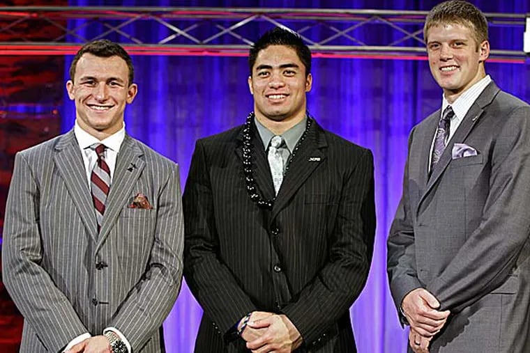 From left, Heisman Trophy candidates Texas A&M's Johnny Manziel, Notre Dame's Manti Te'o and Kansas State's Collin Klein pose for a photo. (John Raoux/AP)