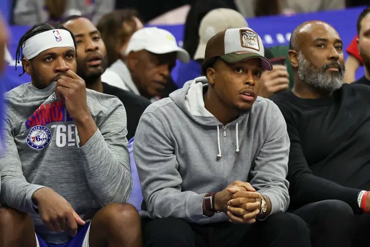 Kyle Lowry (center) watches from the bench as the Sixers blow a 15-point lead in their 115-109 loss to the Grizzlies on Wednesday. He is among the Sixers in a "ramp-up process" for players returning from injury or long absences.