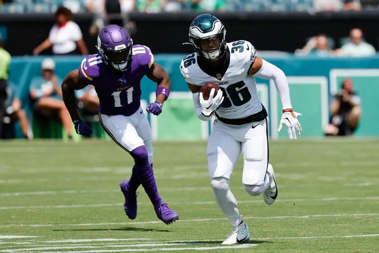 Eagles safety Tristin McCollum runs with the football after an interception past Minnesota Vikings wide receiver Trent Sherfield Sr., during a preseason game on Aug. 24.