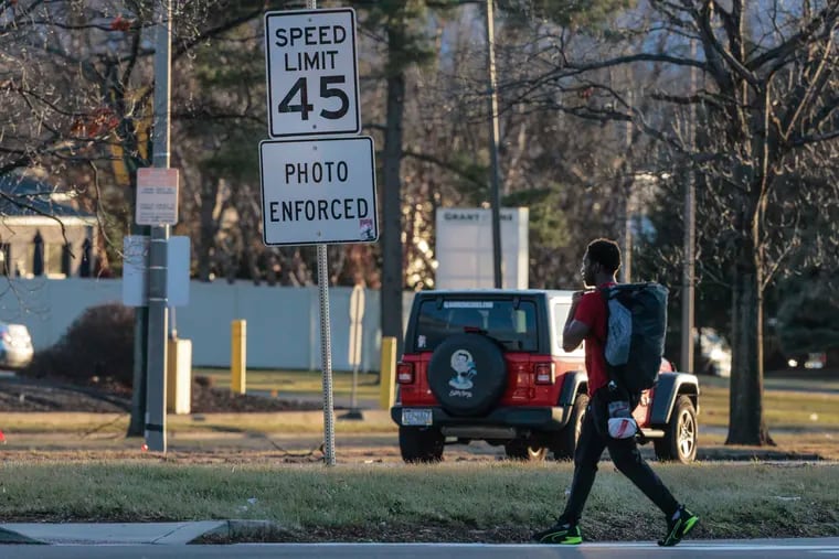 People cross Roosevelt Boulevard at Grant Avenue. A state study recommends expanding speed cameras statewide. The Boulevard cameras would have expired last Dec. 31, but the Pennsylvania legislature approved them permanently.