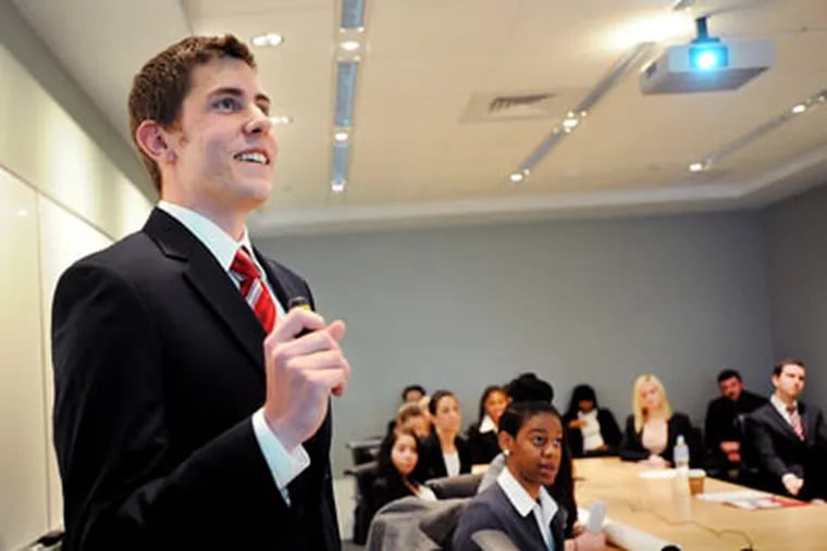 Temple University student Steven McGorry, 23, gives a presentation in the Fox School of Business&rsquo; &ldquo;HR on the Ground&rdquo; class. Students in the class serve as human-resources consultants to a group of regional Target stores. (SHARON GEKOSKI-KIMMEL / Staff Photographer)
