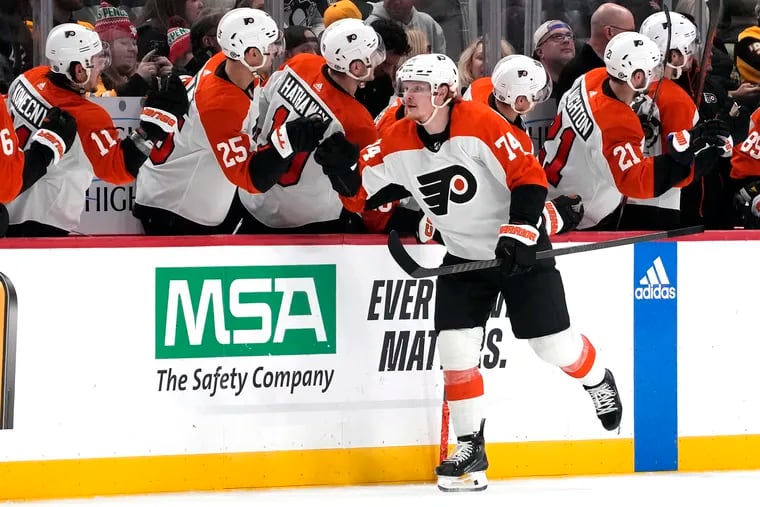 Owen Tippett (74) celebrates with teammates after scoring in the second period.