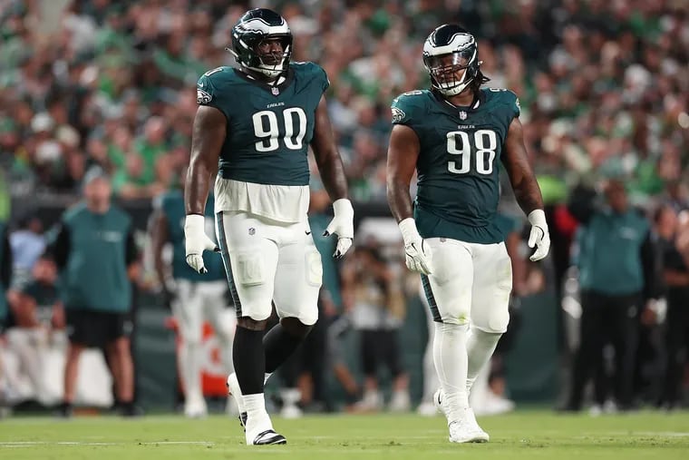 Eagles defensive tackle Jordan Davis (left) and fellow defensive tackle Jalen Carter (right) walk onto the field together as the Philadelphia Eagles play the Atlanta Falcons at Lincoln Financial Field in Philadelphia, Monday, Sept. 16, 2024.