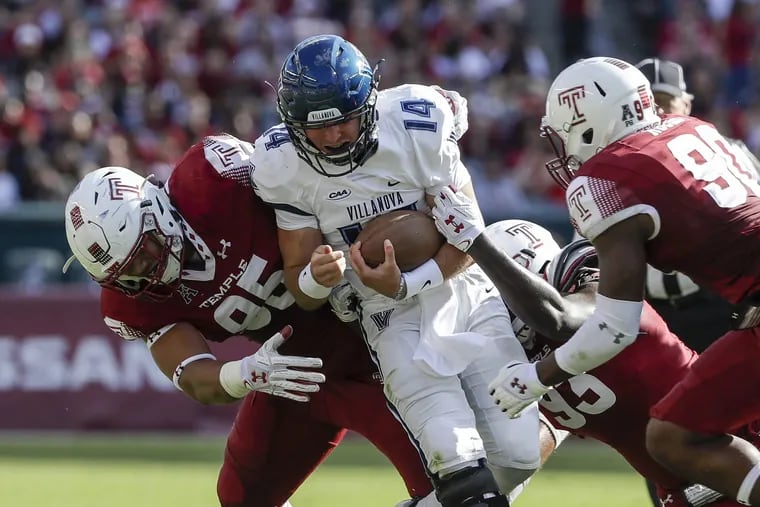 Temple defensive lineman Dan Archibong, left, combined on a sack of Villanova QB Zach Bednarczyk in a 2017 game. Archibong played 48 games for the Owls in his college career.