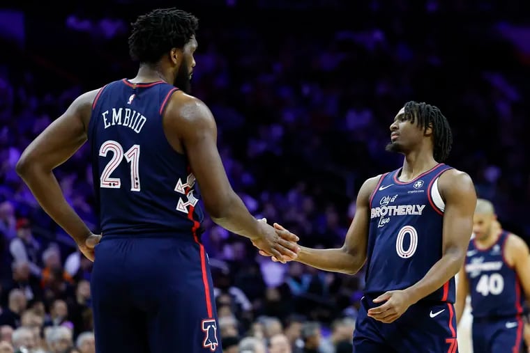 Sixers guard Tyrese Maxey with Joel Embiid during the center's 70-point performance against the San Antonio Spurs on Monday.