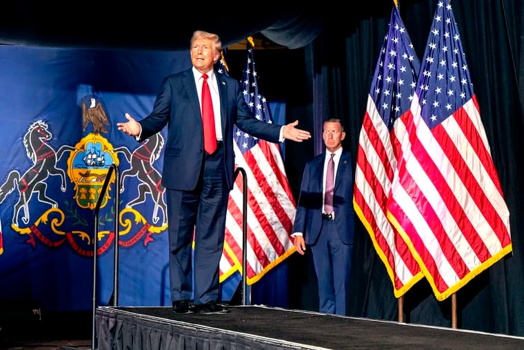 Former President Donald Trump arrives onstage at the Pennsylvania Farm Show Complex in Harrisburg, Wednesday, July 31, 2024.