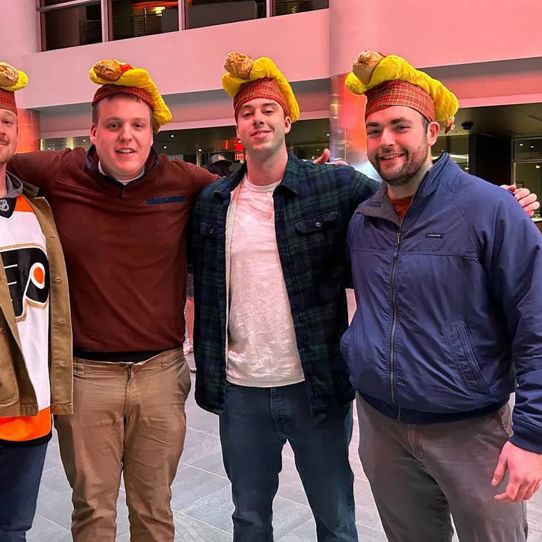 Xander Utecht (from left), Miles Macaleer, Cole Harper, and Brad Allan at the Wells Fargo Center Monday for the Flyers' Dollar Dog Night against the St. Louis Blues.