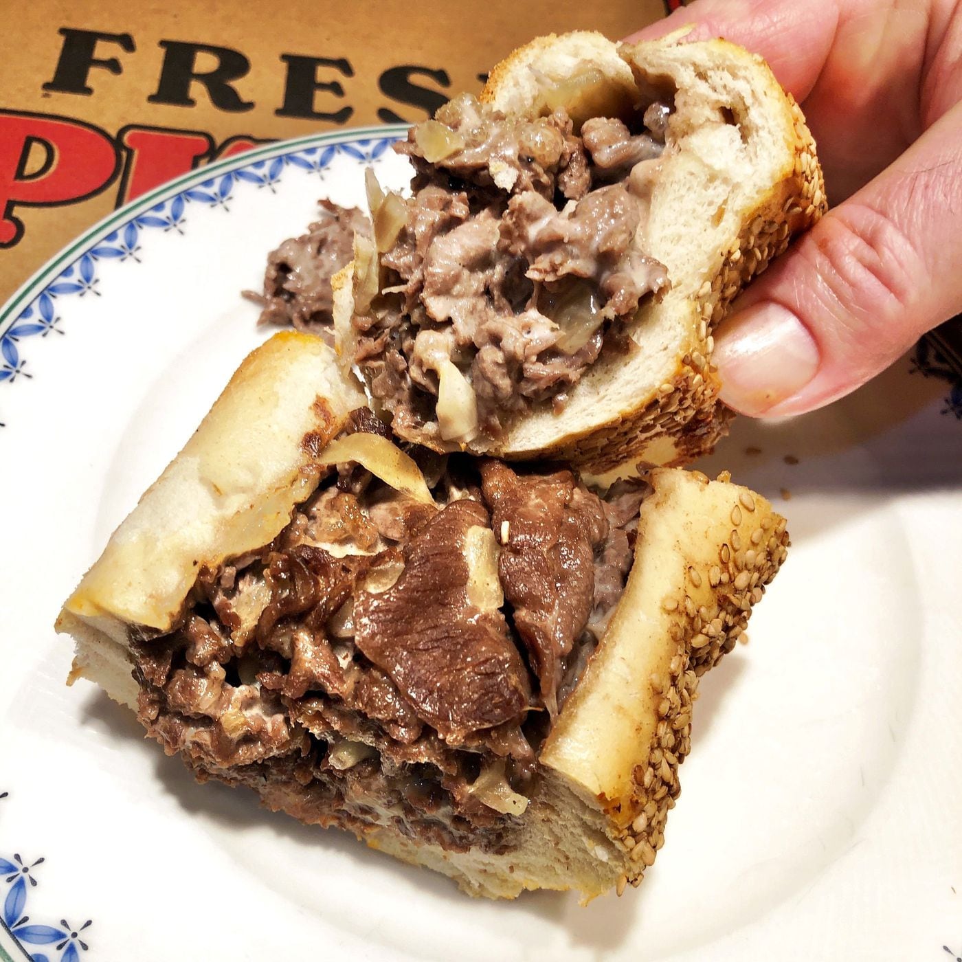 This Don Cheech's cheesesteak at Cafe Carmela is made with sliced ribeye, onions and Cooper Sharp cheese, and is one of the best cheesesteaks around.