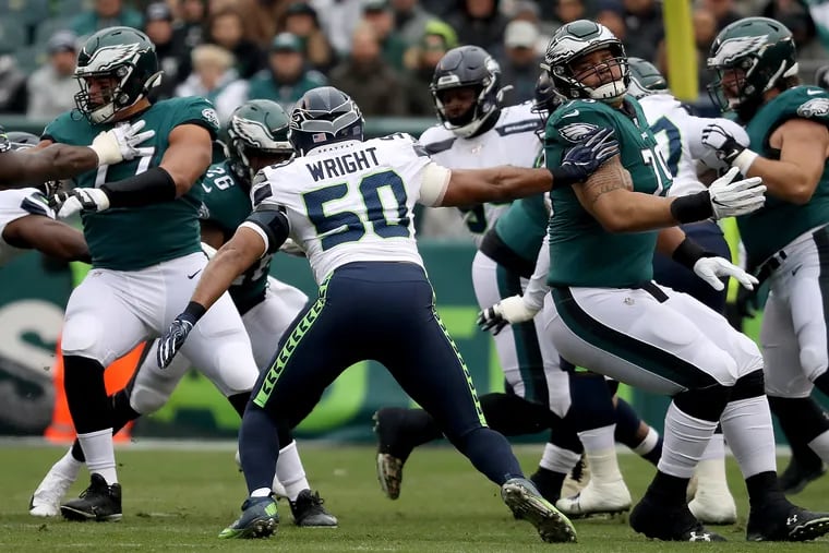 Eagles offensive guard Brandon Brooks (right) tries to block Seattle Seahawks outside linebacker K.J. Wright on Sunday during the Eagles' 17-9 loss.