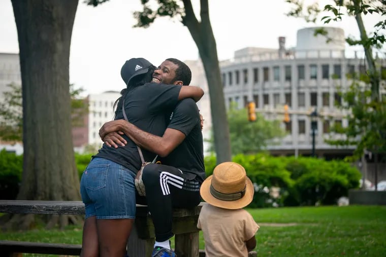 Tremell Foster with his fiancee Erica Jones and son Lennox at Franklin Square, near the Philadelphia Police Administration Building, two days after Foster was released from prison in Philadelphia earlier this month.