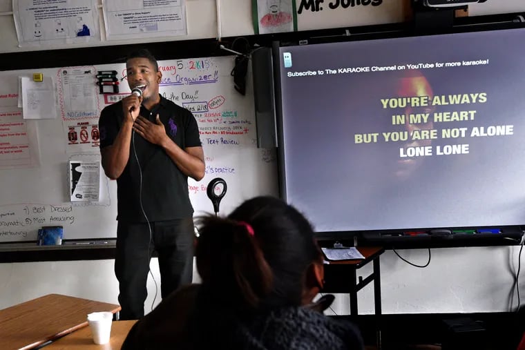 At Camden High in 2015, beloved teacher Alex Jones sings karaoke to his students on the day he told them he was leaving teaching to become an administrator; some of the kids were so upset they cried.