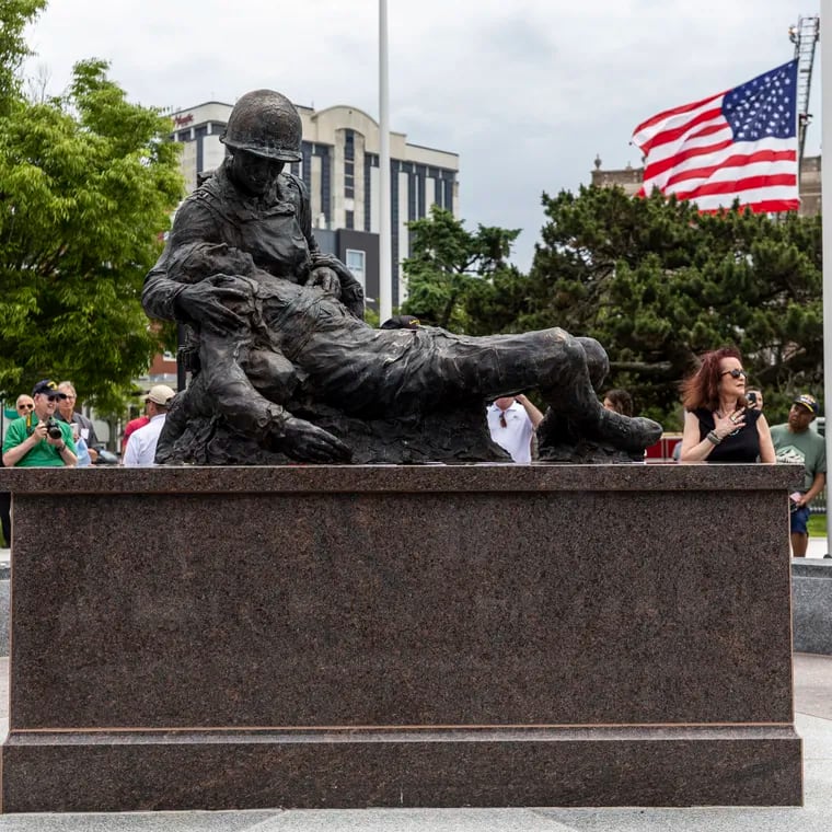 Susan Friedenberg, daughter, unveils the statue during the Bernie Friedenberg World War II Memorial unveiling and Dedication Ceremony at O’Donnell Memorial Park in Atlantic City, N.J., on Thursday, June 6, 2024.
