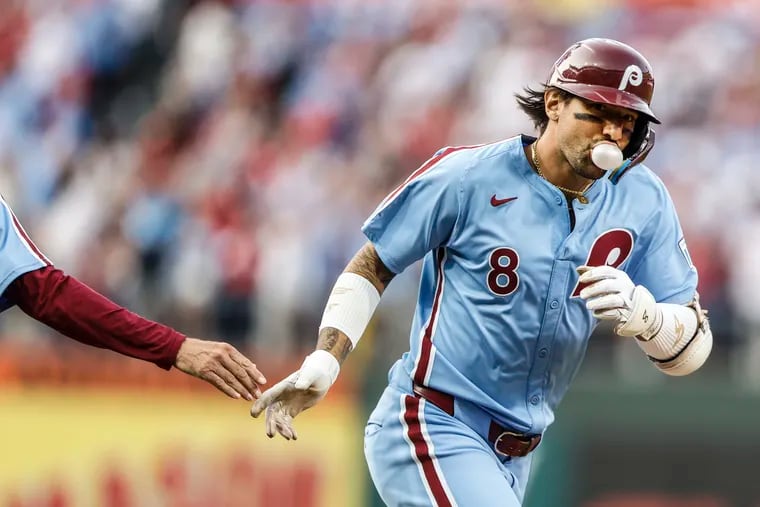 Nick Castellanos blows a bubble as he rounds the bases on a first-inning home run for the Phillies against the Nationals.