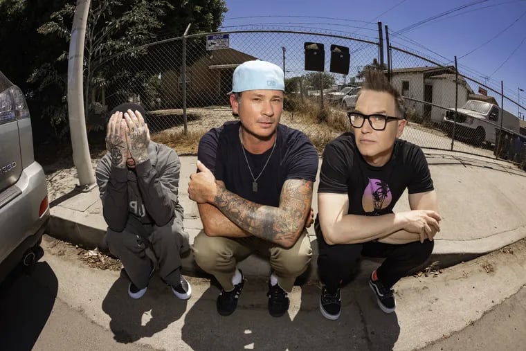 Blink-182, with (from left) Travis Barker, Tom DeLonge, and Mark Hoppus, plays the Wells Fargo Center on Friday.