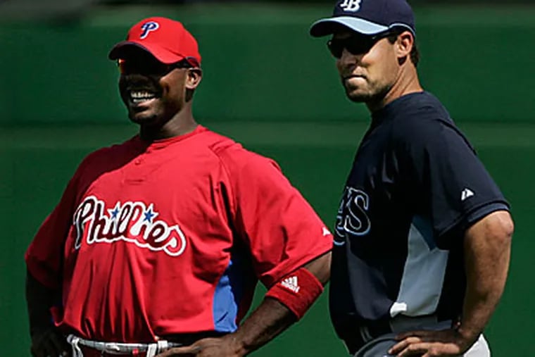 Former Philadelphia Phillies Pat Burrell (right, now of the Rays