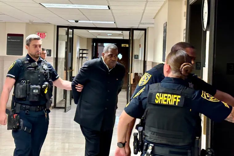 The Rev. Mark Hatcher is escorted out of a courtroom in the Montgomery County Courthouse on Thursday after being sentenced to state prison for raping and sexually assaulting three children.