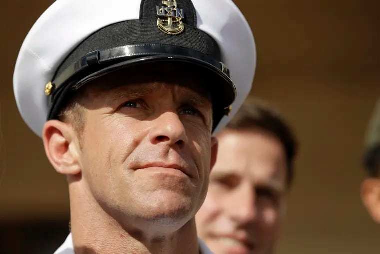 FILE - In this July 2, 2019, file photo, Navy Special Operations Chief Edward Gallagher leaves a military court on Naval Base San Diego in San Diego. President Donald Trump says he has directed the secretary of the Navy and chief of naval operations to “immediately withdraw and rescind” the Navy Achievement Medal from prosecutors who argued the case against Gallagher, a decorated Navy SEAL. Military jurors earlier this month acquitted Gallagher in the death of a wounded Islamic State captive under his care in Iraq.