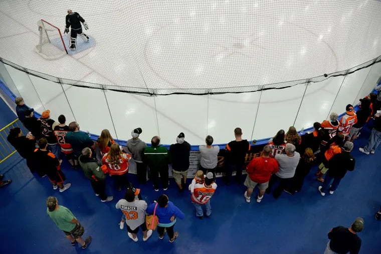 Flyers' fans, shown watching a scrimmage at training camp in 2015, will be allowed at training camp, which begins on Sept. 23. Fans have not been permitted at Voorhees for 18 months due to COVID-19 restrictions.
