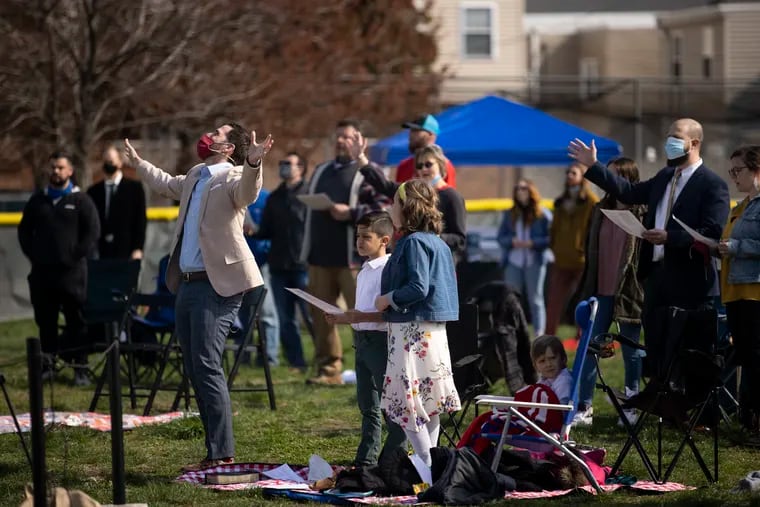 Lead pastor Jeff Boettcher during the Christ Church Easter service at the Edward O'Malley baseball field in South Philadelphia on Sunday. Christ Church is located a few blocks from the EOM field.