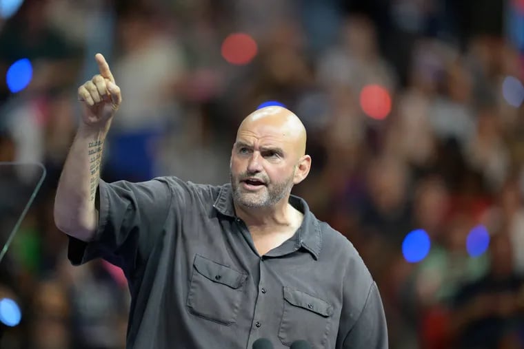 Senator John Fetterman speaks during an event with US Vice President Kamala Harris & Gov. Tim Walz at Temple University's Liacouras Center in Philadelphia, Pennsylvania, August 6, 2024.