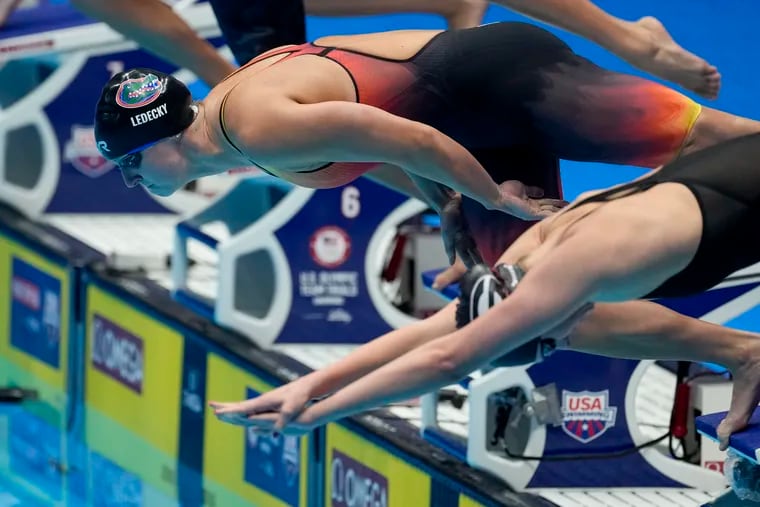 Swimming superstar Katie Ledecky leaps into the pool during last month's U.S. Olympic trials.