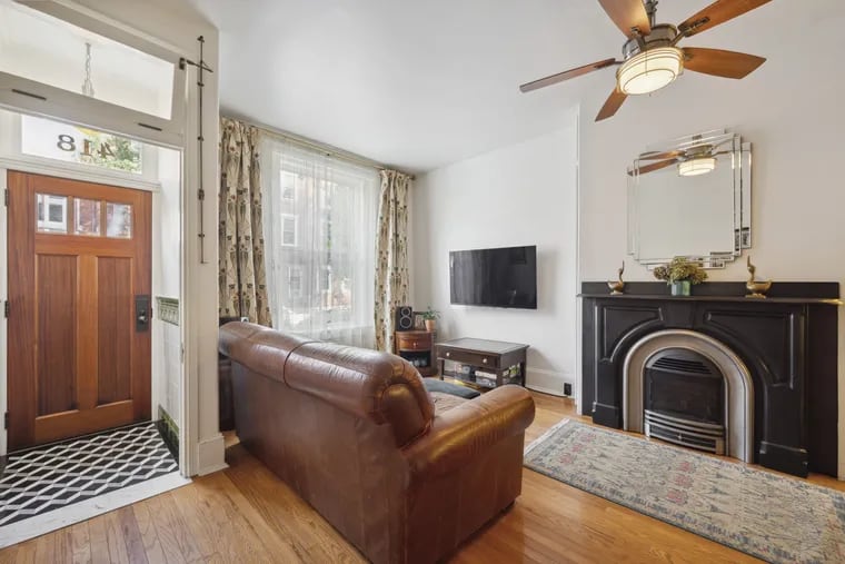 The tile in the vestibule was designed by the homeowners, who renovated much of the home over 14 years.