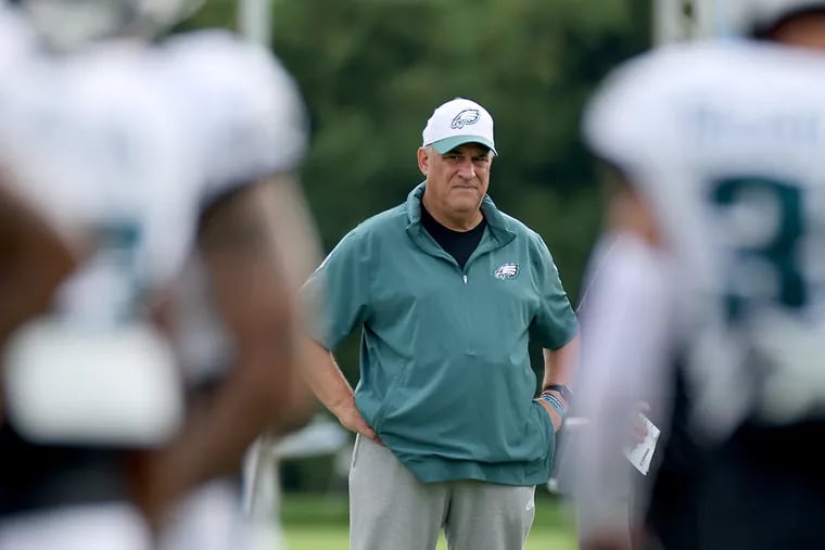 Eagles defensive coordinator Vic Fangio watches practice on Sunday.