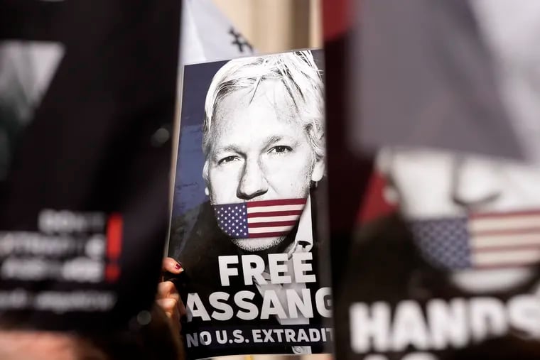 Protesters hold placards in support of WikiLeaks founder Julian Assange outside the High Court in London on Monday, May 20, 2024.