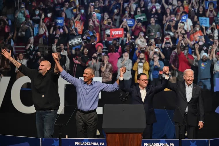 John Fetterman, then a candidate for Senate; former President Barack Obama, Josh Shapiro, running for governor; and President Joe Biden participate in a rally ahead of the midterm elections on Nov. 5, 2022, in Philadelphia.