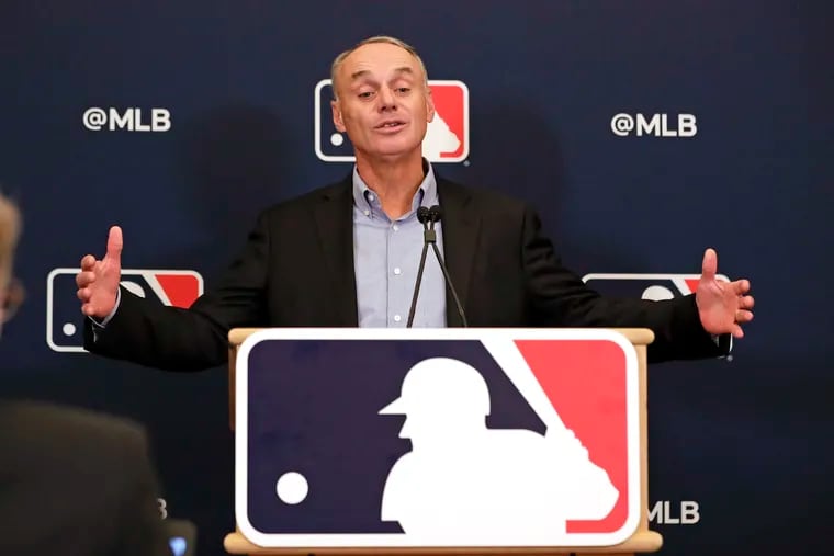 MLB commissioner Rob Manfred answers questions at a press conference during owners meetings in February.