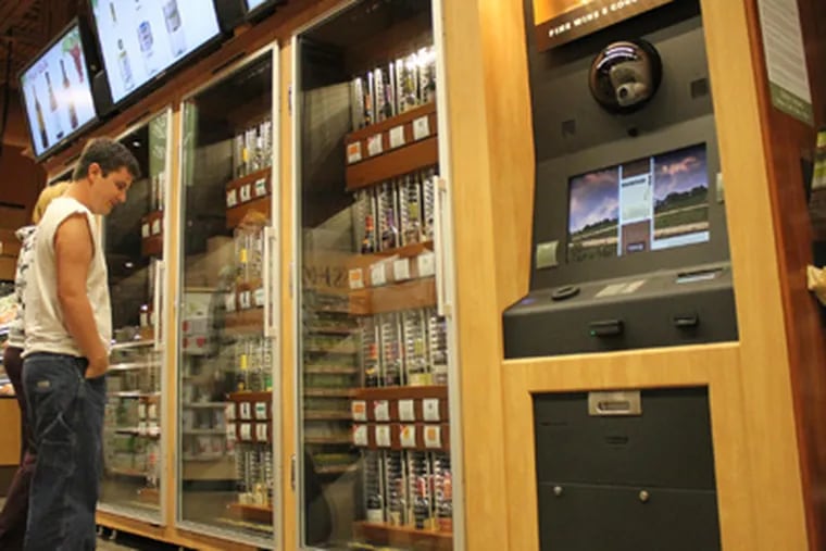 Wine kiosks located in groceries have not been the answer to private liquor stores. (Evan Trowbridge / File Photo)