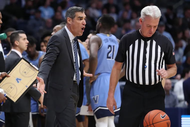 Coach Jay Wright, left, of Villanova expresses displeasure with a call during their game against Penn on Dec. 4, 2019 at the Finneran Pavilion at Villanova University