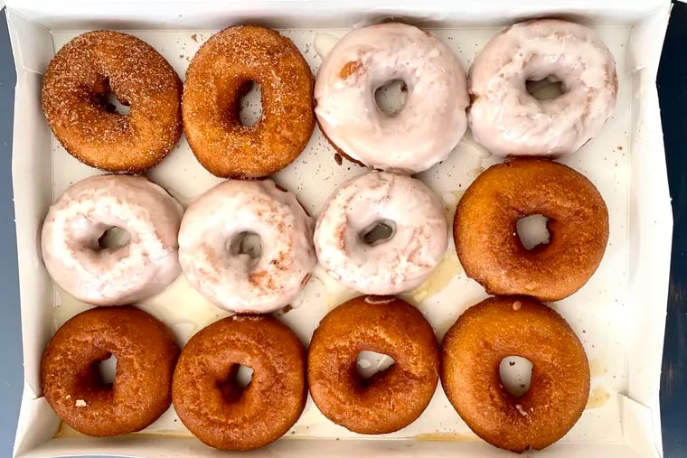 A mixed dozen of hot doughnuts from Brown's Restaurant in Ocean City includes, clockwise from top left, cinnamon sugar, vanilla glazed, and honey-dipped.