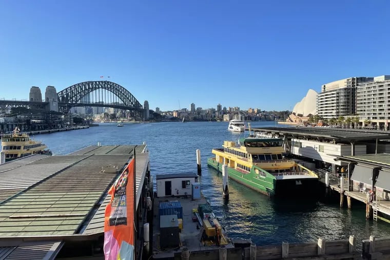 A view of the Sydney waterfront, including the city's famed Harbour Bridge and Opera House, from a platform at the Circular Quay train station.