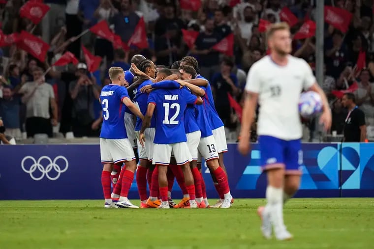 France celebrates after Michael Olise scored his team's second goal against the United States.