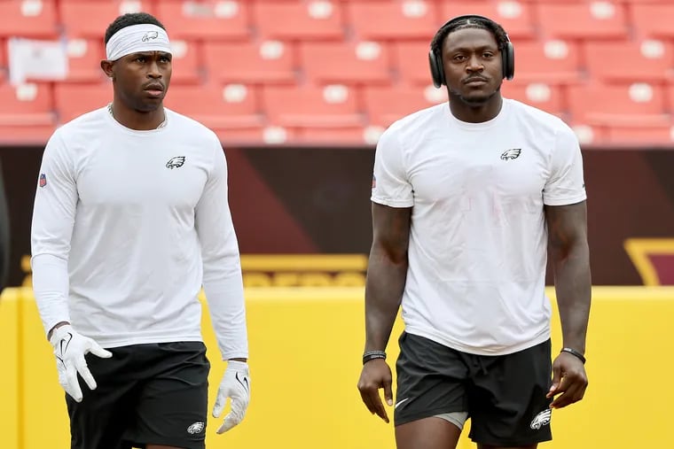 Philadelphia Eagles wide receiver Julio Jones (left) and fellow wide receiver A.J. Brown (right) walk together as they warm up before the Philadelphia Eagles play the Washington Commanders at FedEx Field Landover, Pa. on Sunday, Oct. 29, 2023.