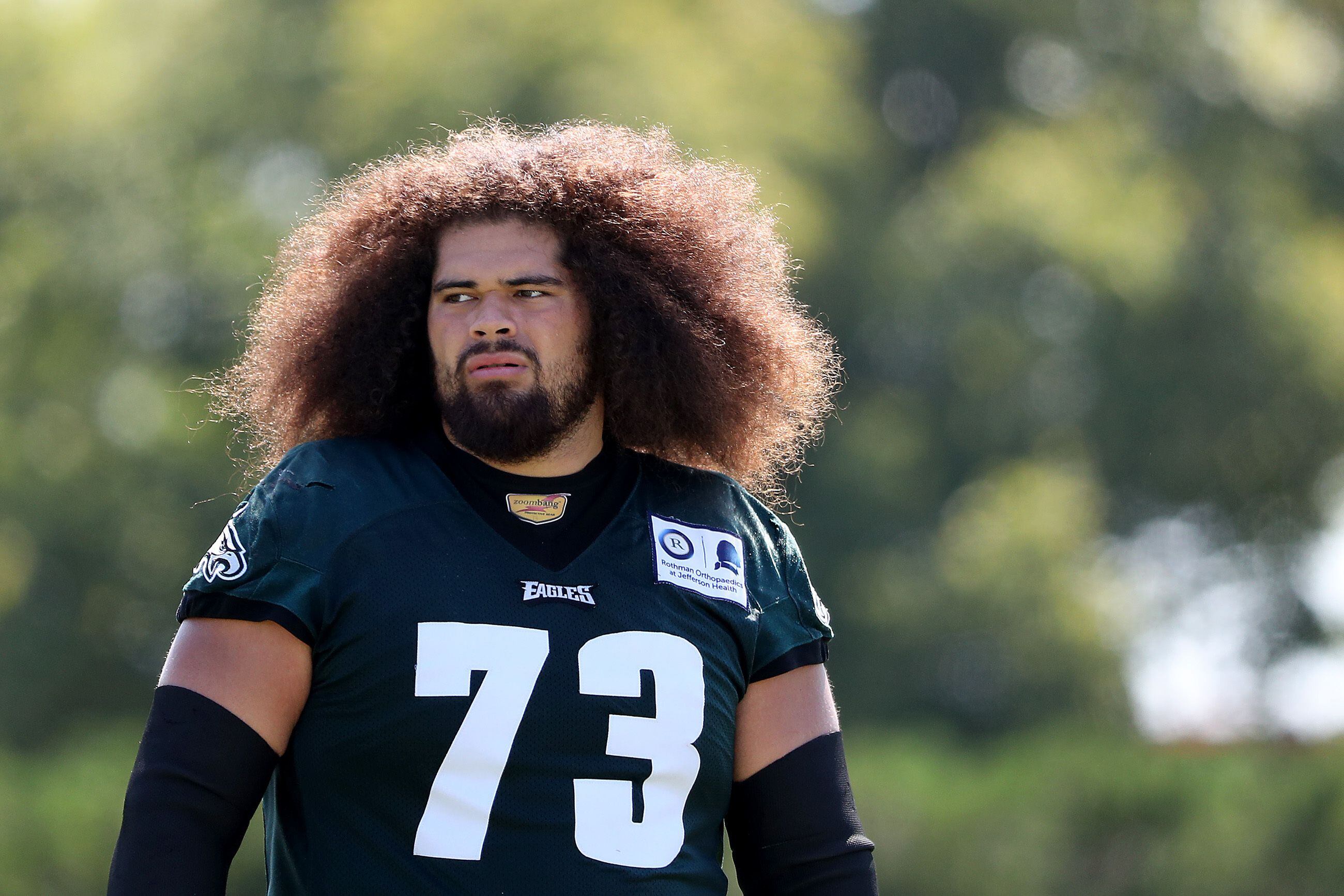 Philadelphia Eagles offensive guard Isaac Seumalo (73) looks at the  scoreboard replay of a fumble his team returned for a touchdown in the  fourth quarter against the Washington Redskins at FedEx Field