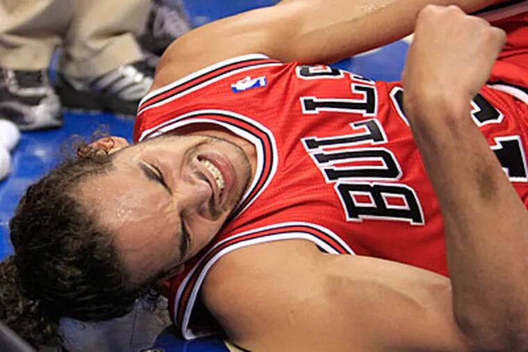 Bulls center Joakim Noah suffered a sprained left ankle in Game 3 on Friday. (Ron Cortes/Staff Photographer)